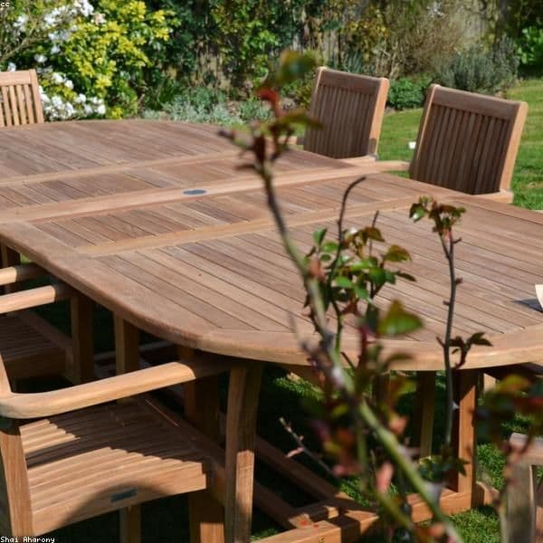 Luxury outdoor patio with teak furniture and fire pit